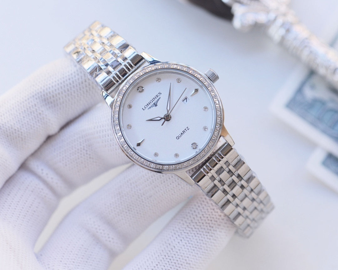 Longines watch with silver bezel and two-tone metal bracelet; white dial, quartz hands