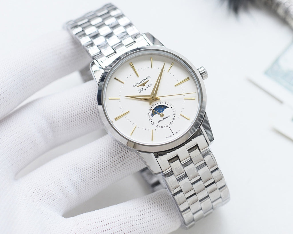Analog watch with white dial and stainless steel bracelet, gold-tone accents
