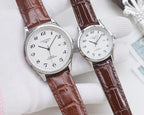 Longines watch pair, silver cases with white dials and brown leather straps