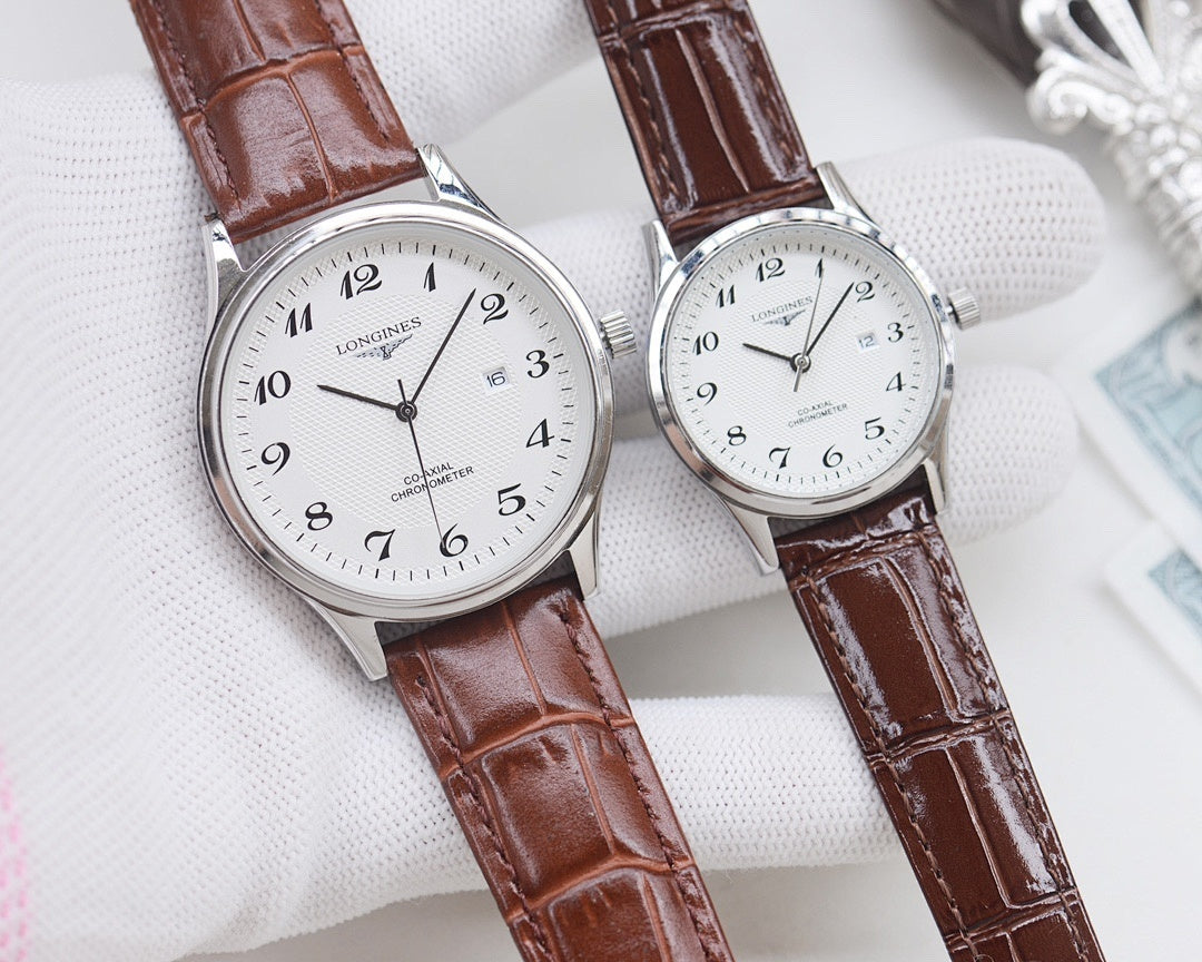 Longines watch pair, silver cases with white dials and brown leather straps