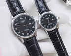 Longines watch pair, silver cases with black dials and black leather straps