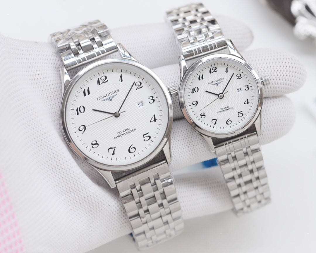 Longines watch pair, silver cases with white dials and silver metal bracelets