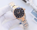 Longines wristwatch with blue dial, two-tone bracelet, date window at 3 o'clock.