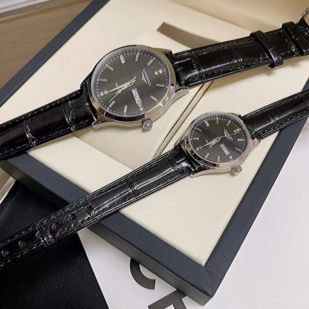 Longines watch with dark dial and black leather strap, displayed in box.