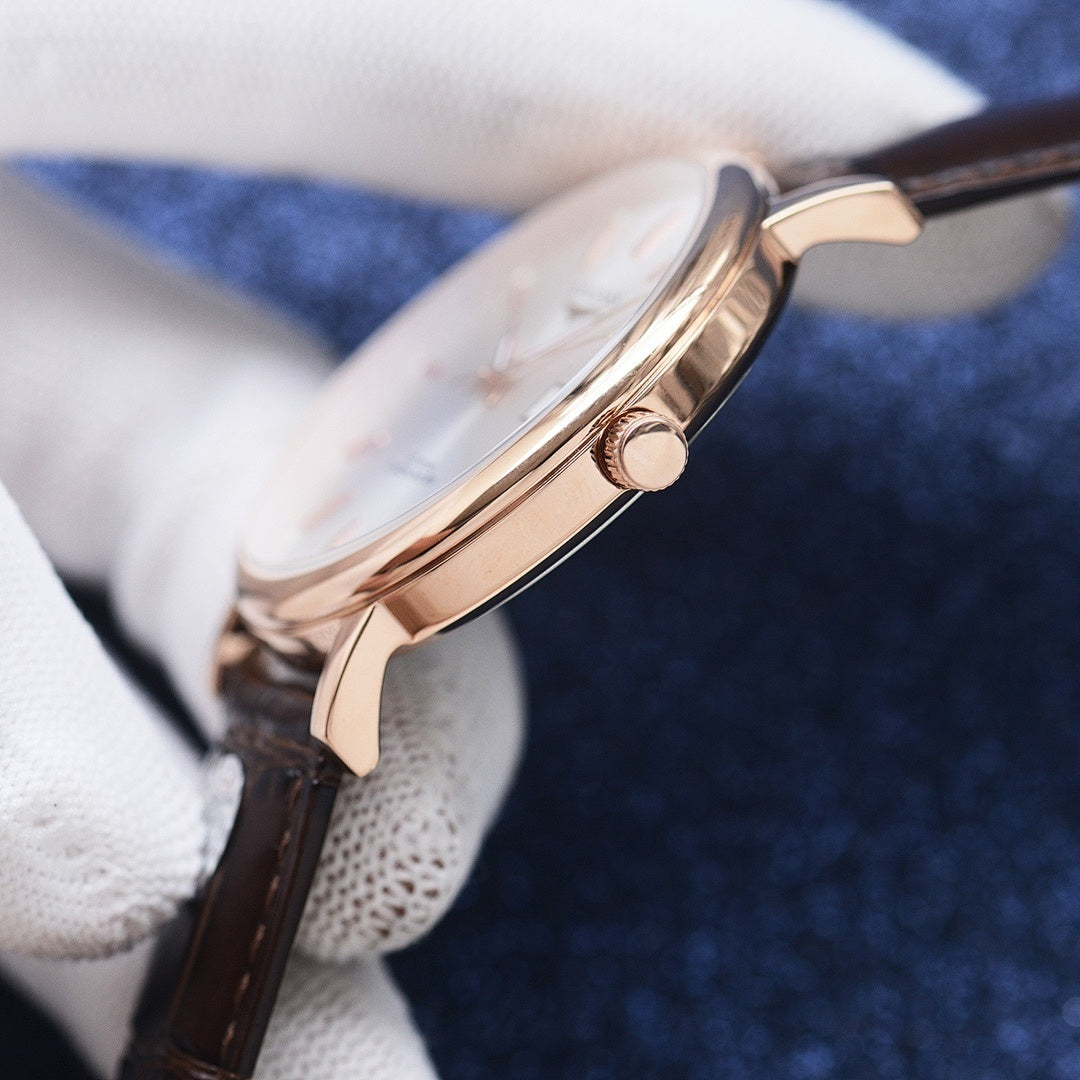 Longines watch side view, rose-gold case with crown and brown leather strap