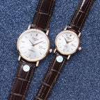 Longines watch pair with white dial and brown leather straps, rose-gold tone cases