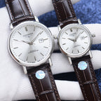 Longines watch with white dial, silver case, brown leather strap, stick indices