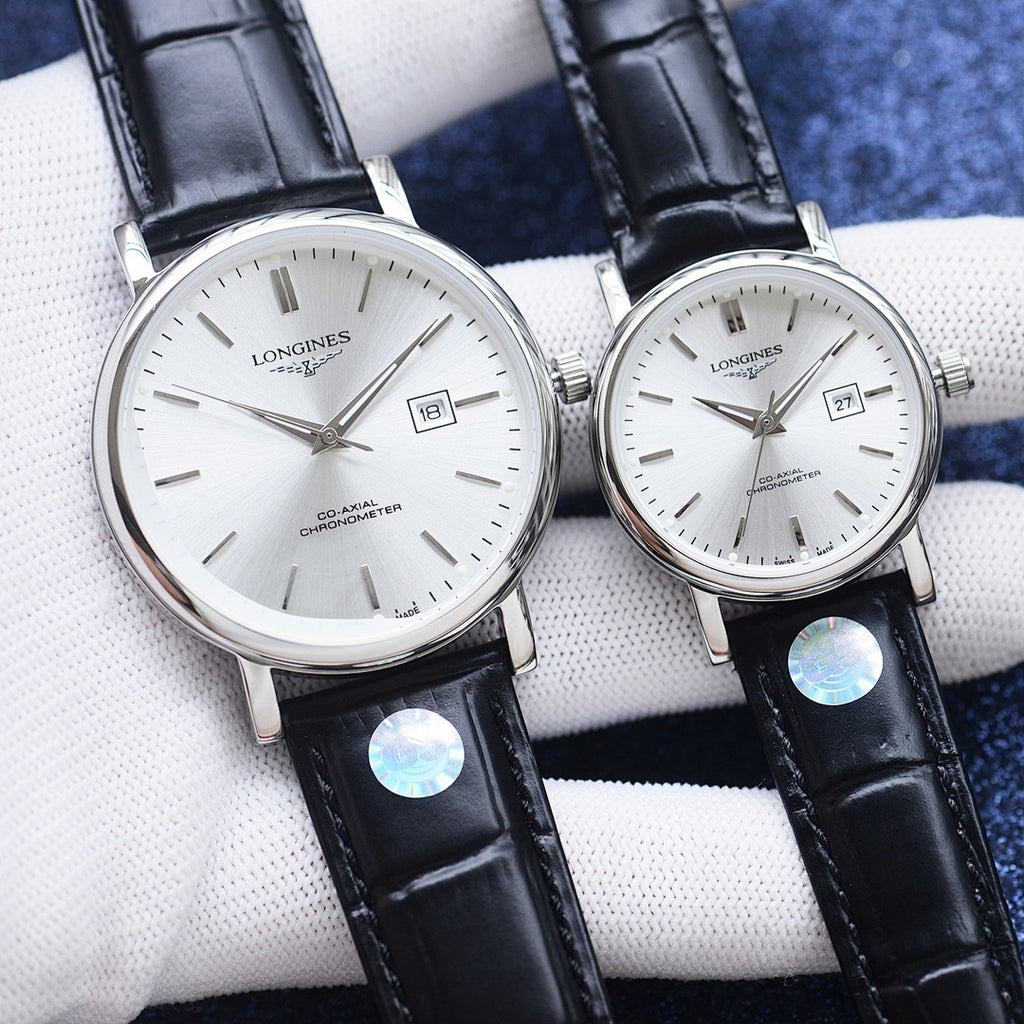 Longines watch pair with white dial, silver cases, black leather straps