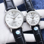 Longines watch pair with white dial, silver cases, black leather straps
