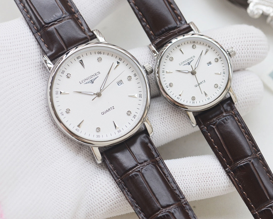 Longines quartz watch set with silver tone cases and dark brown leather straps
