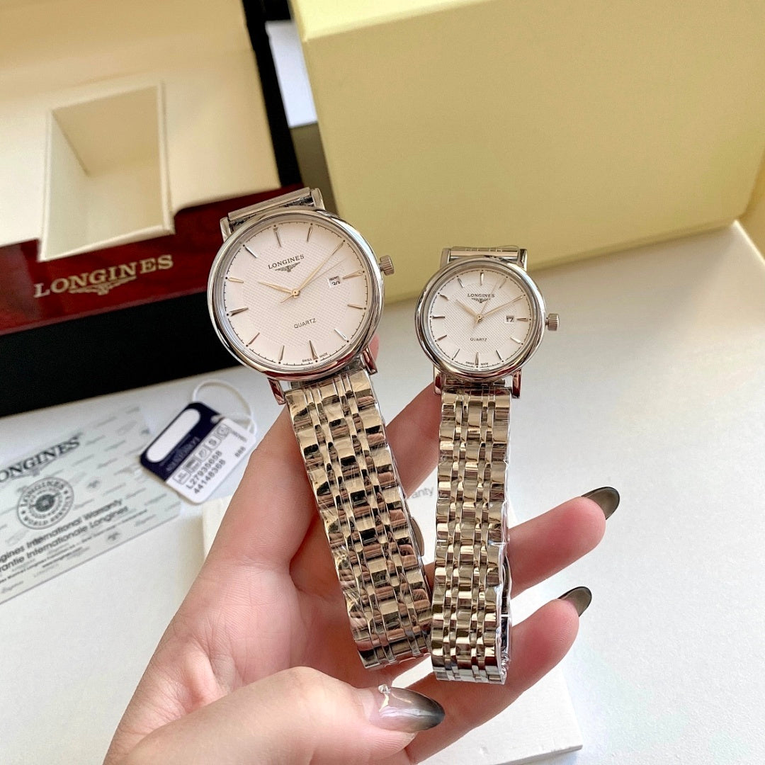 Rose-tone wristwatch with white dial and metal link bracelet, held in hand