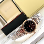 Stainless-steel wristwatch with black dial, rose-tone hands, metal link bracelet
