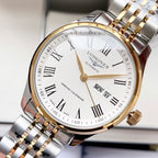 Longines watch with white dial, gold bezel, gold accents, date MON 8