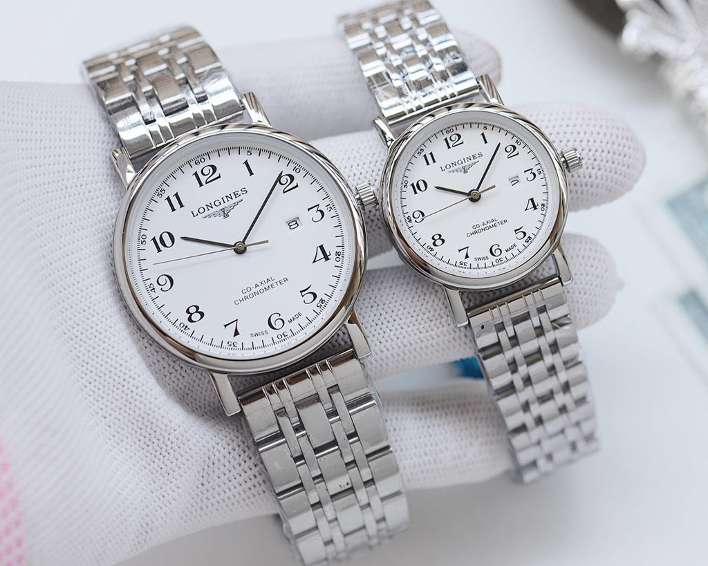 Pair of stainless steel wristwatches with light dials and linked metal bracelets