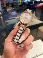 Longines rose gold-tone wristwatch with round face and metal link bracelet