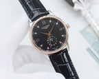 Longines wristwatch with black leather strap and dark dial, rose-gold tone case