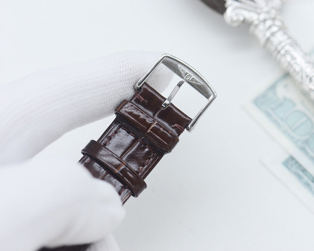 Longines leather watch strap with metal buckle, shown from the side