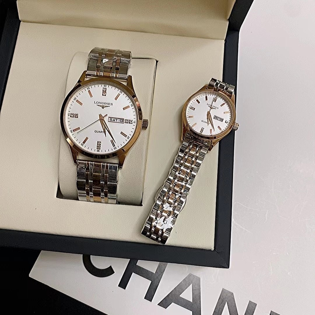 Two stainless steel wrist watches with white dials in a gift box