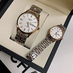 Two stainless steel wrist watches with white dials in a padded gift box