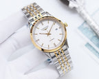 Automatic wristwatch with white dial, gold-tone accents, and metal link bracelet