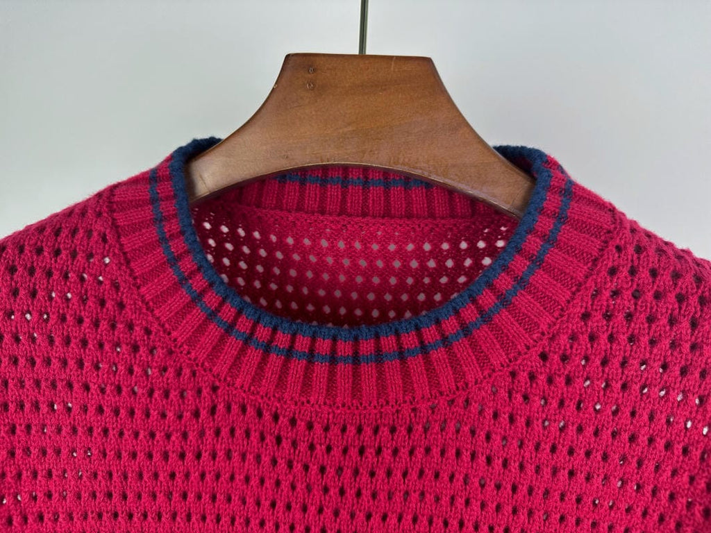 Magenta knit sweater neckline with ribbed crew collar and blue-trim stripes