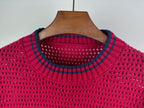 Magenta knit sweater neckline with ribbed crew collar and blue-trim stripes
