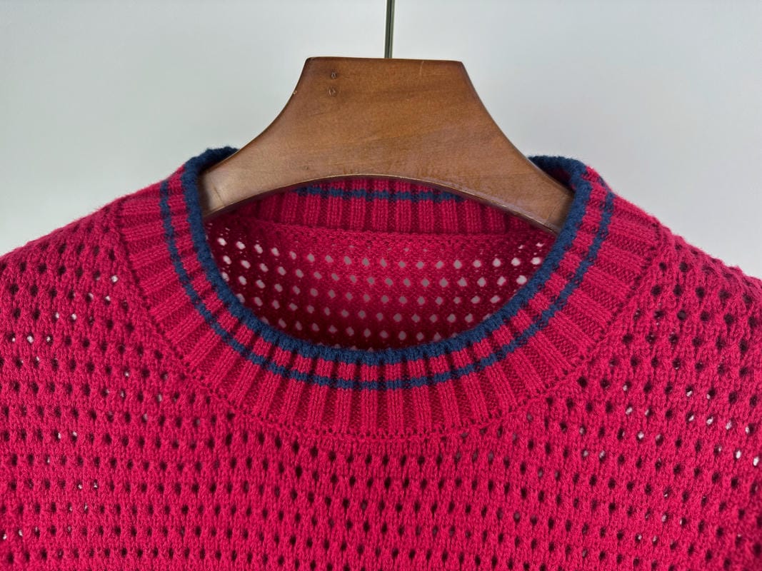 Magenta knit sweater neckline with ribbed crew collar and blue-trim stripes