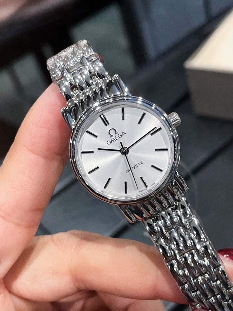 Omega De Ville wristwatch close-up, white dial and silver-tone bracelet