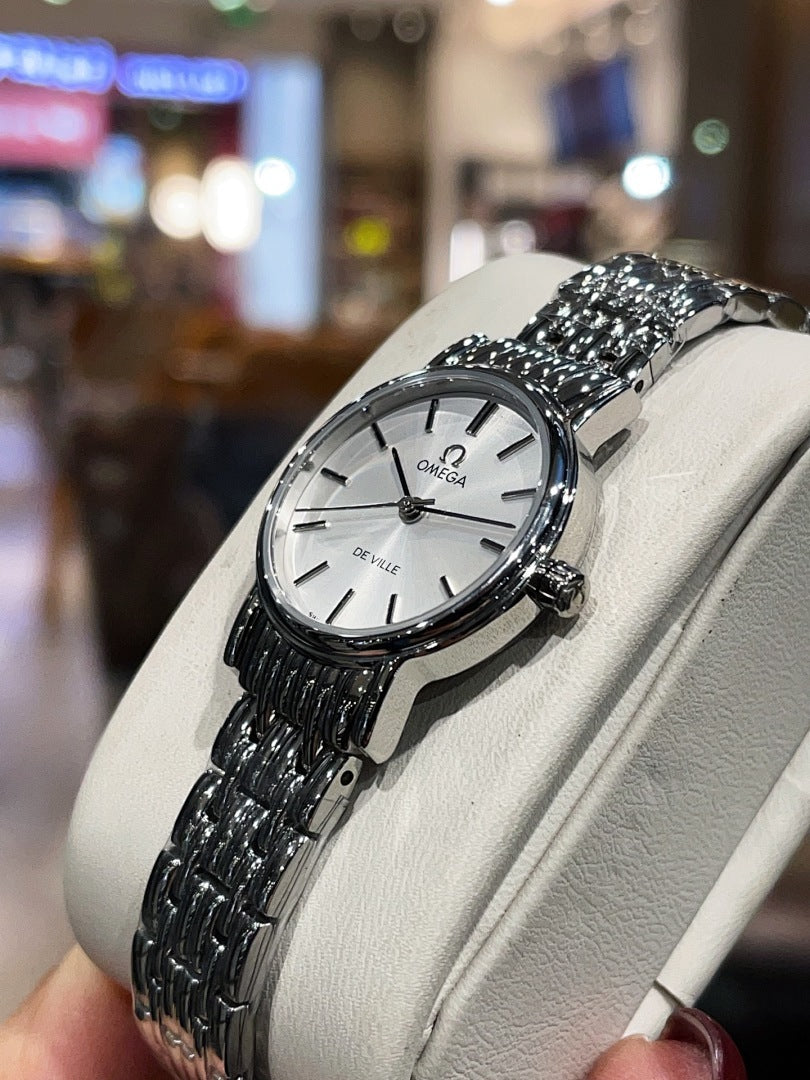 Omega De Ville wristwatch angled view, white dial and silver metal bracelet