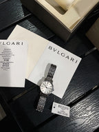 Omega De Ville wristwatch with silver metal bracelet, on jewelry cards