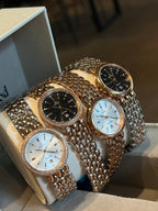 Set of three Omega wristwatches with black and white dials and metal link bracelets