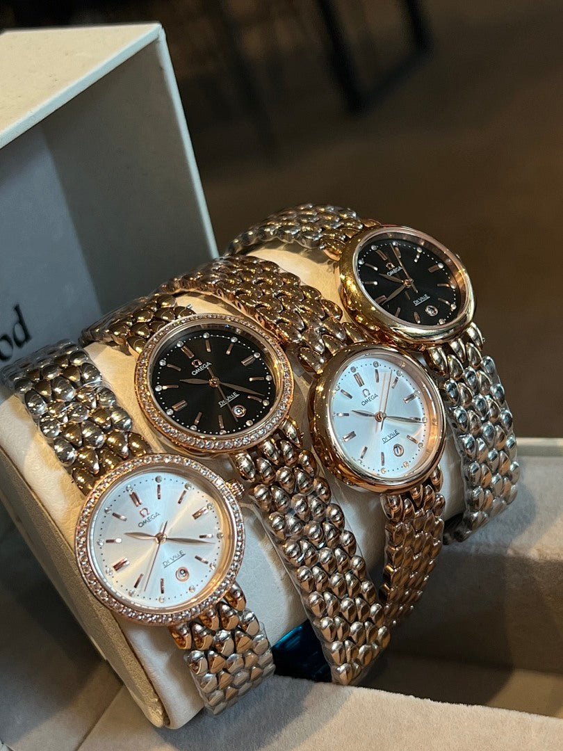 Set of three Omega wristwatches with black and white dials and metal link bracelets