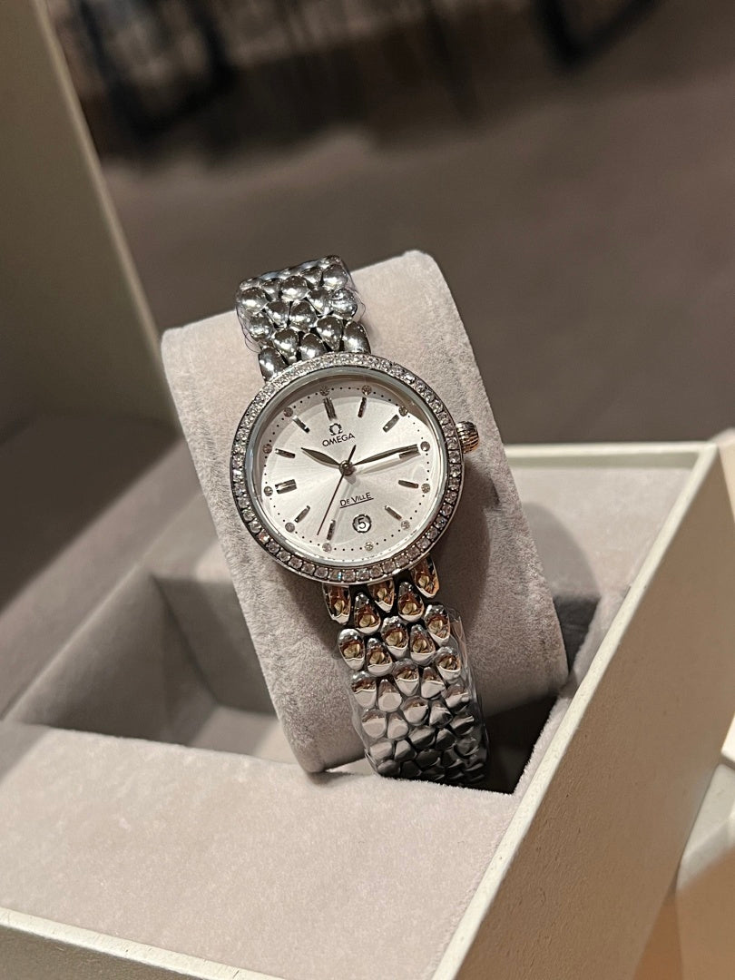 Omega wristwatch with white dial, sparkling bezel, textured metal bracelet, small crown
