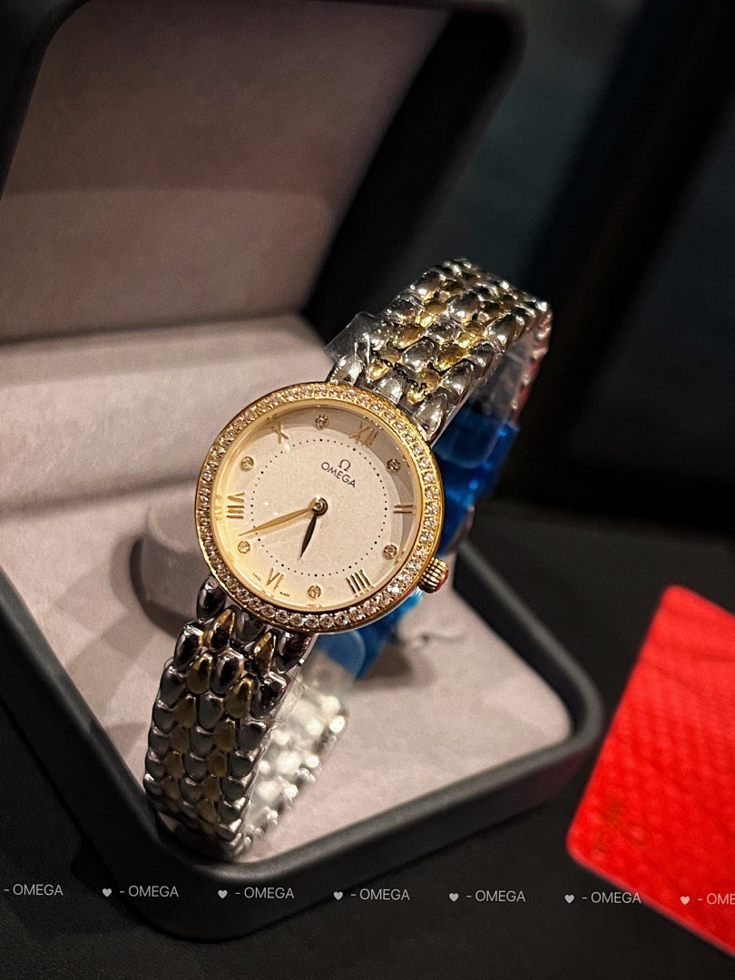 Omega wristwatch with gold-tone case, champagne dial, and textured metal link bracelet