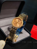 Omega wristwatch with gold-tone case, champagne dial, and textured gold bracelet