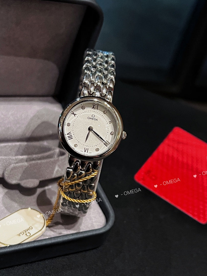 Omega watch with silver link bracelet, white dial, and yellow cord detail