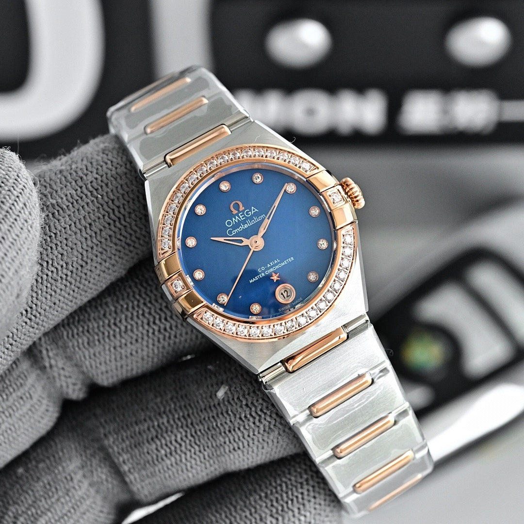 Omega wristwatch with deep blue dial, rose-gold bezel with diamond markers, and metal bracelet.