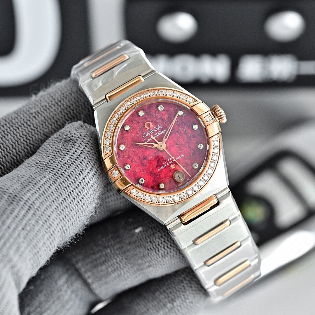 Omega wristwatch with red-pink dial, rose-gold bezel with diamond accents, and metal bracelet.