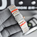 Omega wristwatch side view with metal bracelet and red inlay accents.