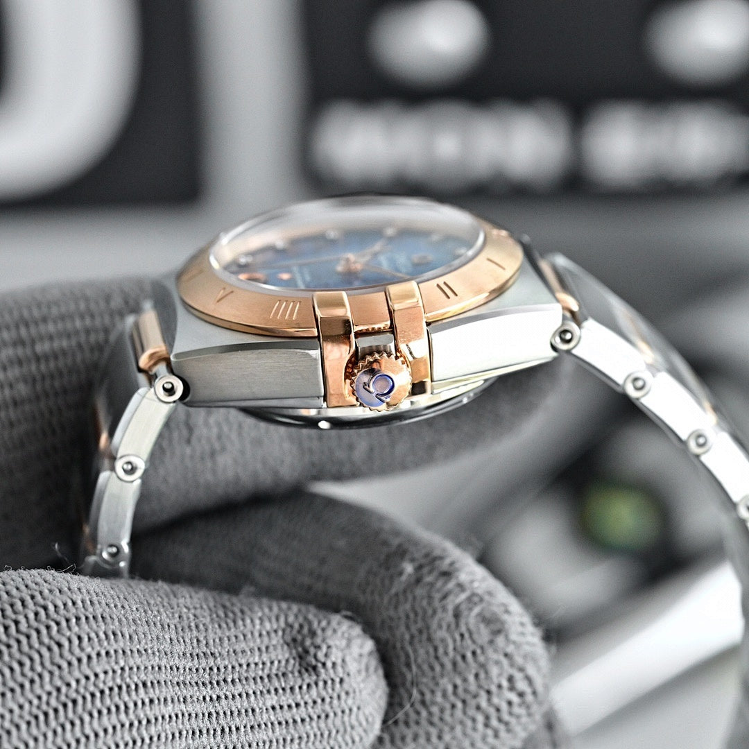 Two-tone wristwatch with light-blue dial, metal bracelet, and rose-gold bezel