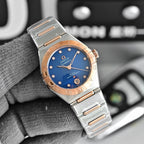 Two-tone wristwatch with blue dial, metal bracelet, and rose-gold bezel