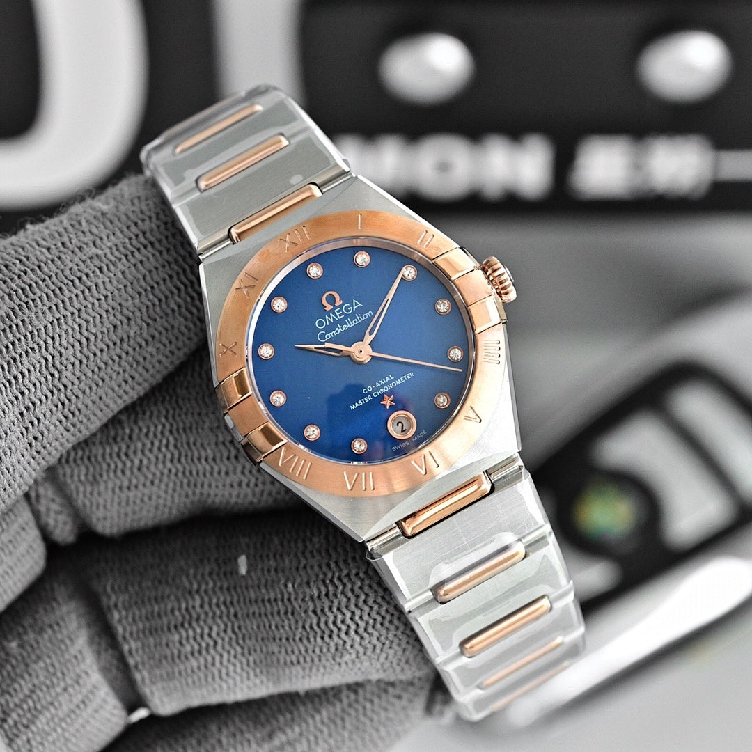 Two-tone wristwatch with blue dial, metal bracelet, and rose-gold bezel