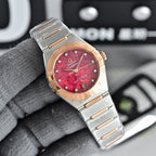 Two-tone wristwatch with red dial, metal bracelet, and rose-gold bezel