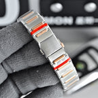 Two-tone wristwatch with silver dial accents and rose-gold bezel, metal bracelet