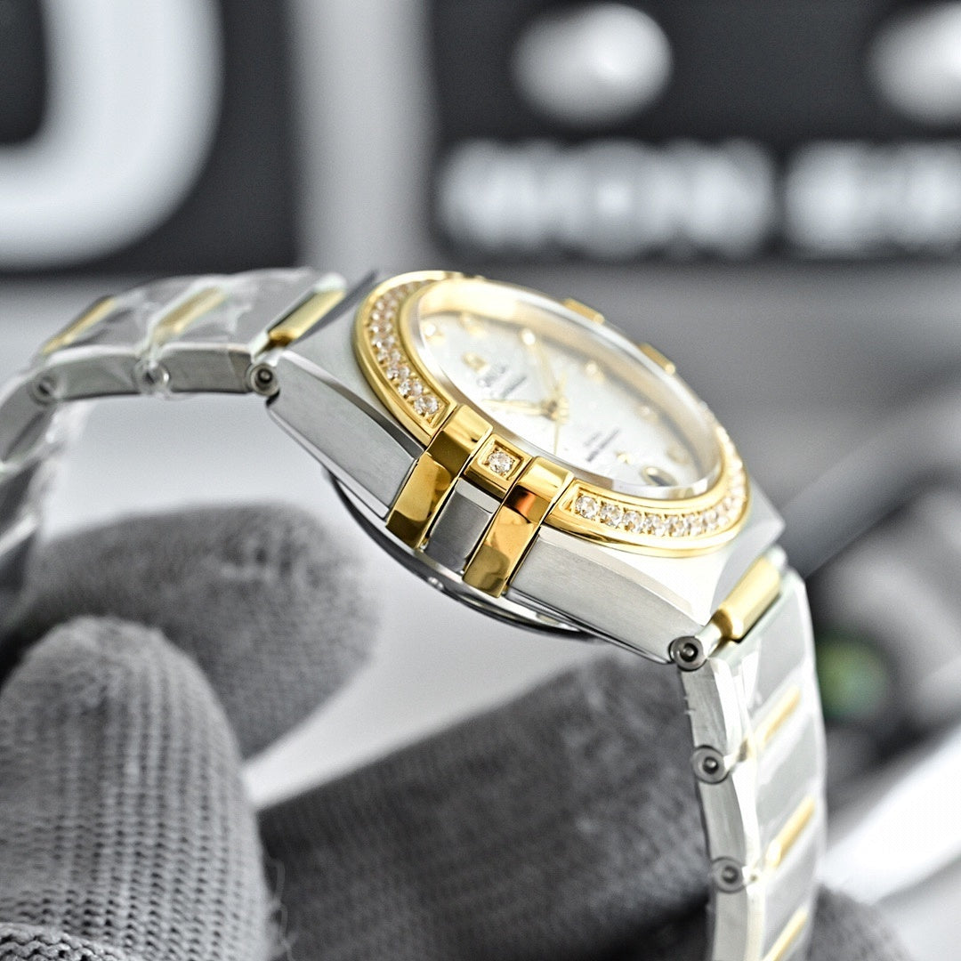 Two-tone watch with white dial, gold bezel, and gold-toned hour markers on bracelet