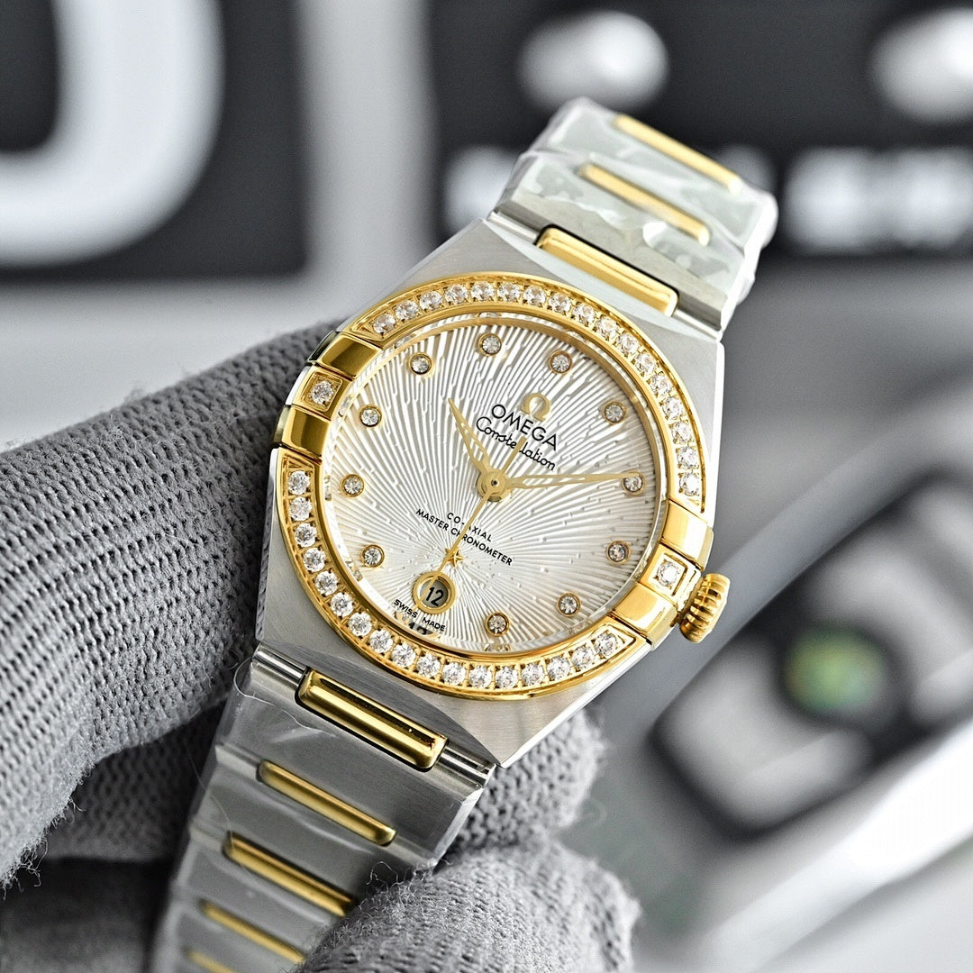 Two-tone watch with white dial, gold bezel with stones, and steel bracelet