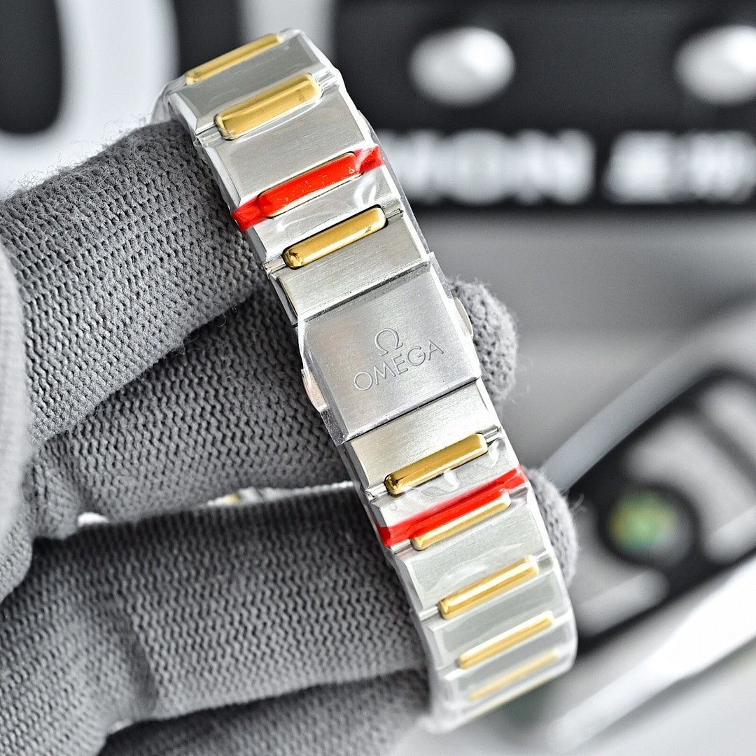 Two-tone watch with silver face, gold side studs, and red accents on steel bracelet