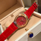 Omega wristwatch with red dial, rose-gold case, red leather strap