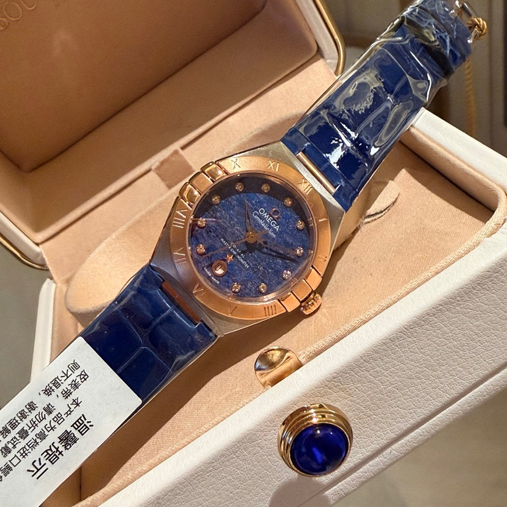 Omega wristwatch with blue dial, rose-gold case, blue leather strap