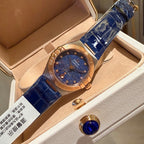 Omega wristwatch with blue dial, rose-gold case, blue leather strap